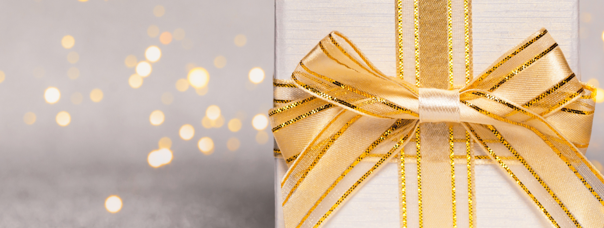 Gold lights with gold present on gray background