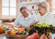 Older Asian Couple Cooking in Kitchen